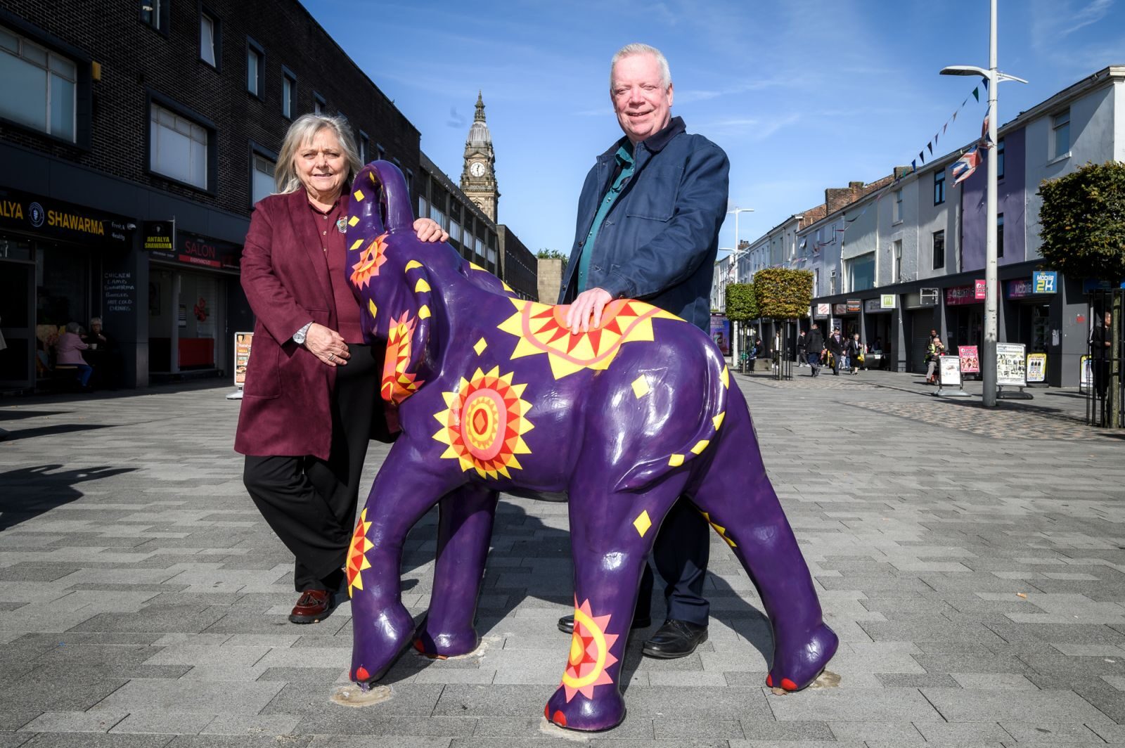 Bolton Council’s Deputy Leader, Cllr Martin Donaghy and Bolton Council’s Executive Cabinet Member for Culture, Cllr Debbie Newall with the elephants